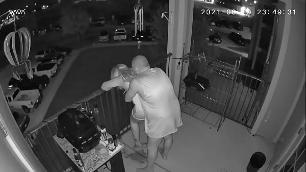 Couple caught on the balcony