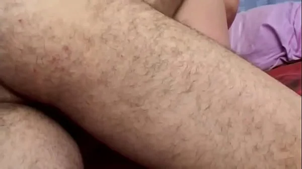 A mature woman over 60 gives a blowjob to an inexperienced young man