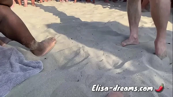 Naughty at beach in front of a lot of voyeurs