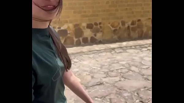 Two lesbians touch each other to orgasm on the corner of a town trying to avoid being seen by anyone