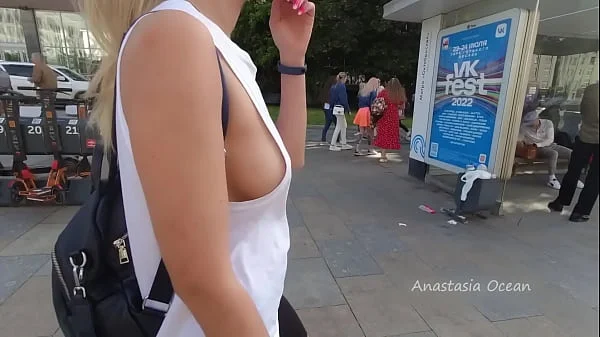 Wearing open T-shirt in crowd. Public. Flashing